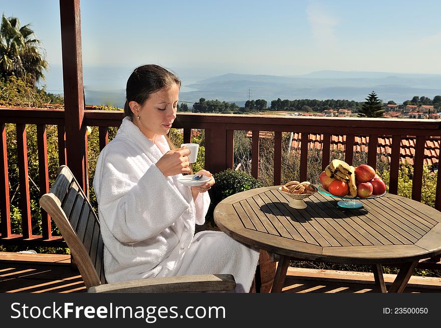 Woman Drinking Coffee On The Nature