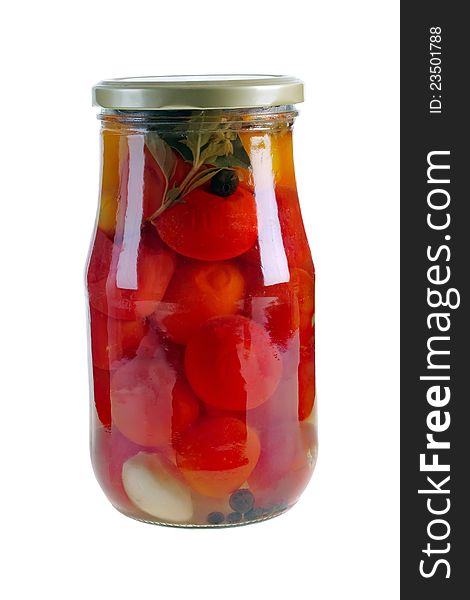 Tomatoes vegetables canned in glass jars on a white background. Tomatoes vegetables canned in glass jars on a white background