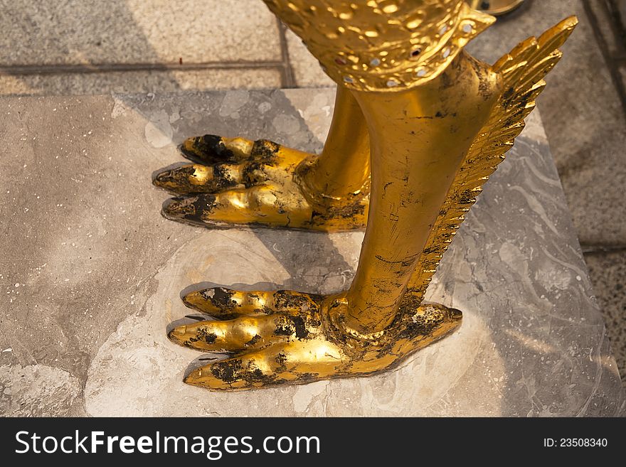 Foot of Guardian angel on cement fall