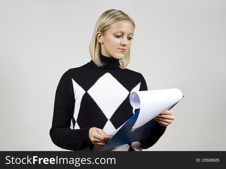 Beautiful girl carefully read the contract. Beautiful girl carefully read the contract