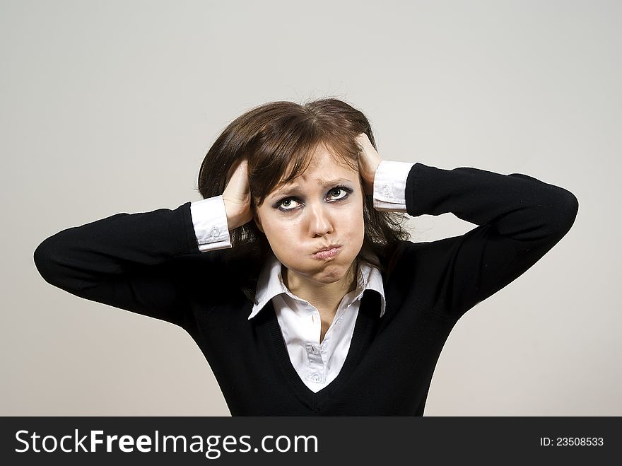 Beautiful girl unhappy look on top of the background. Beautiful girl unhappy look on top of the background