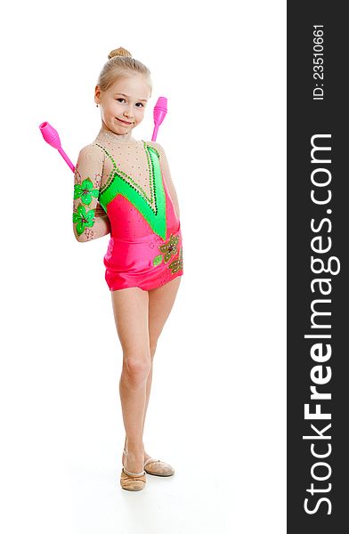 Young pretty girl doing gymnastics over white background