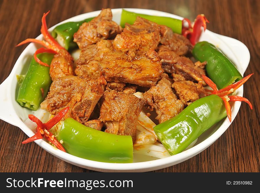 Vegetables and pork in a white plate,taken in china. Vegetables and pork in a white plate,taken in china