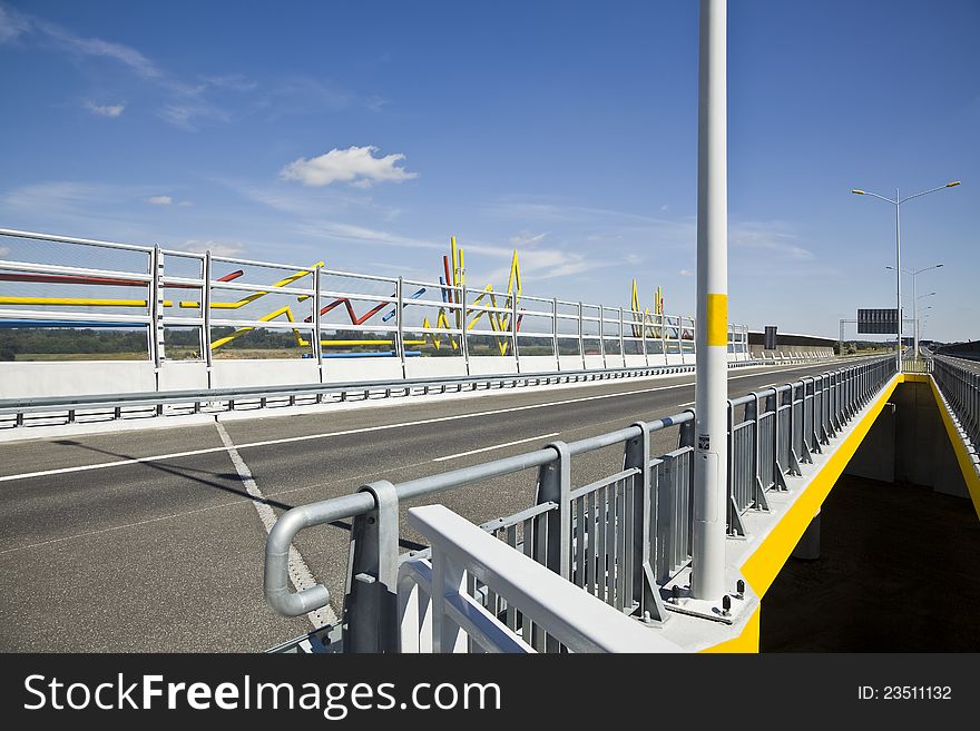 Sound absorption walls and bridge on a highway. Sound absorption walls and bridge on a highway