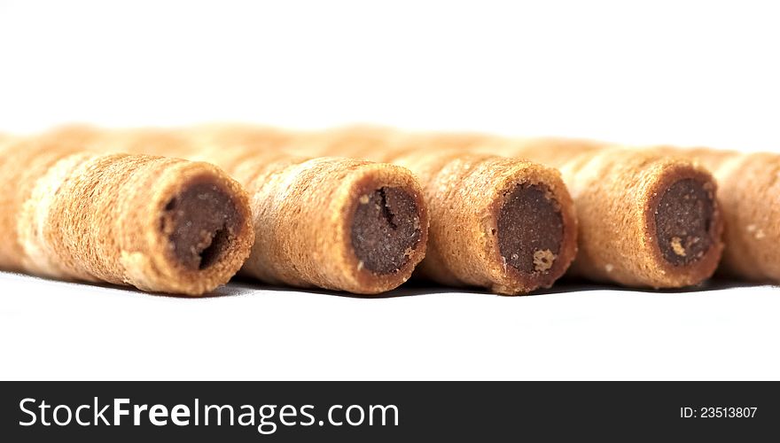 Chocolate wafer rolls siding parallel to each other