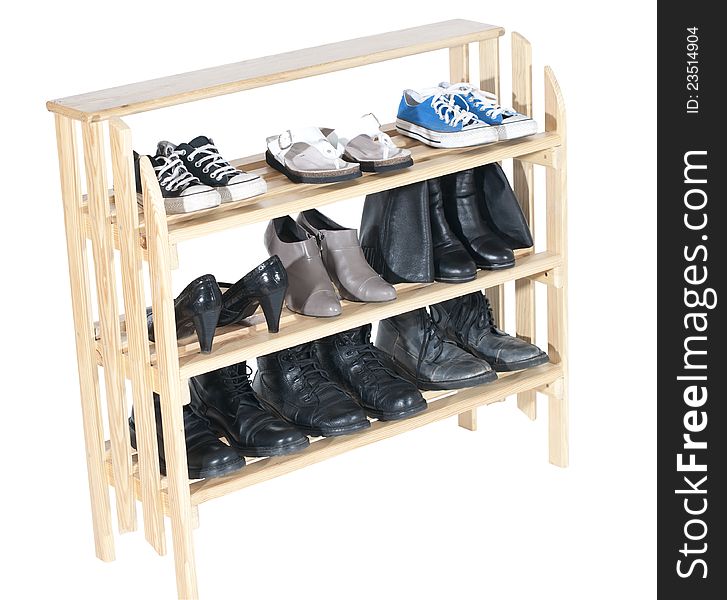 Wooden shelves with shoes, isolated on white