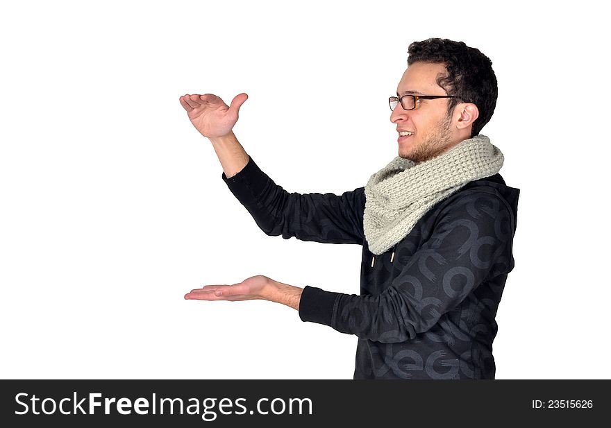 A teenager positioning his hands in a way suitable for holding a vertical product of that size. in the picture, the product is invisible. A teenager positioning his hands in a way suitable for holding a vertical product of that size. in the picture, the product is invisible