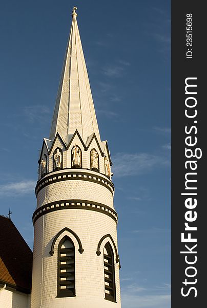 Church spire against a blue sky in Canada