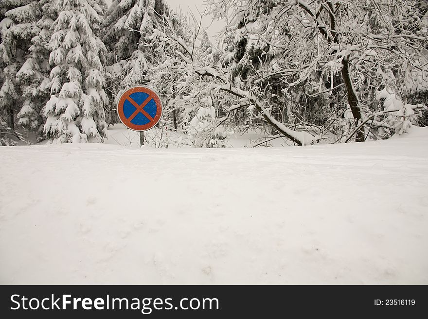 Winter landscape in the Czech Republic, snowy trees, traffic signs in the snow, winter day without the sun, the Czech countryside in winter in the mountains. Winter landscape in the Czech Republic, snowy trees, traffic signs in the snow, winter day without the sun, the Czech countryside in winter in the mountains