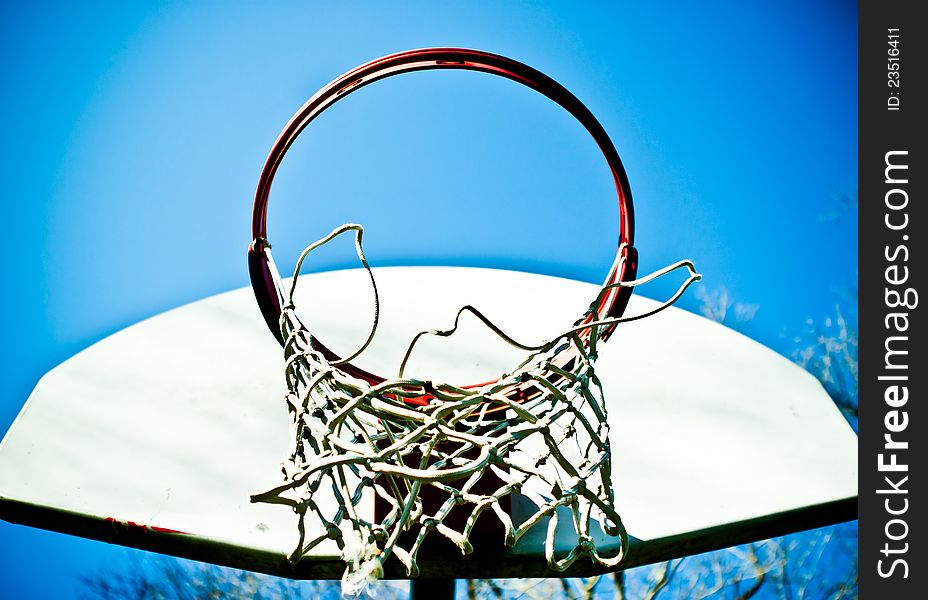 Basketball hoop with torn net