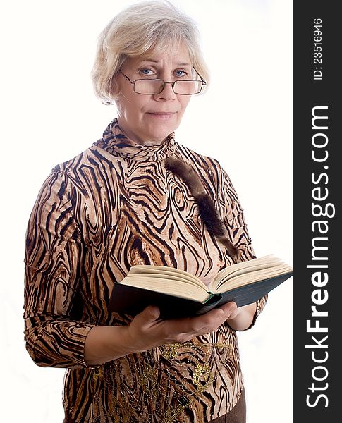 Elderly woman holding a book and looking at camera. Elderly woman holding a book and looking at camera