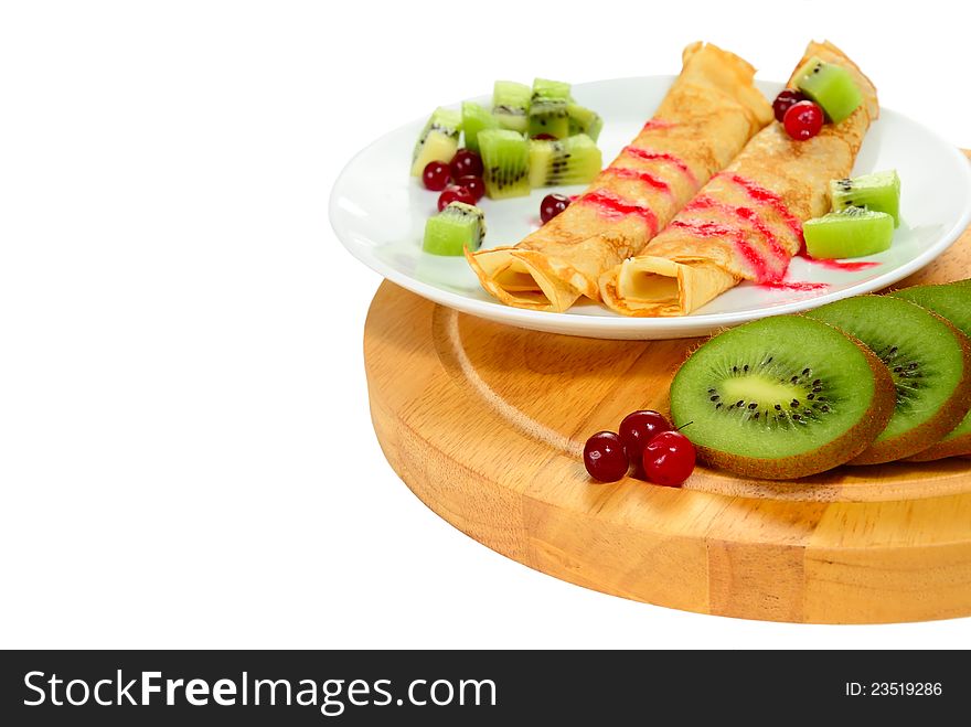 Russian pancake with cranberry and slice kiwi, on white background. Russian pancake with cranberry and slice kiwi, on white background