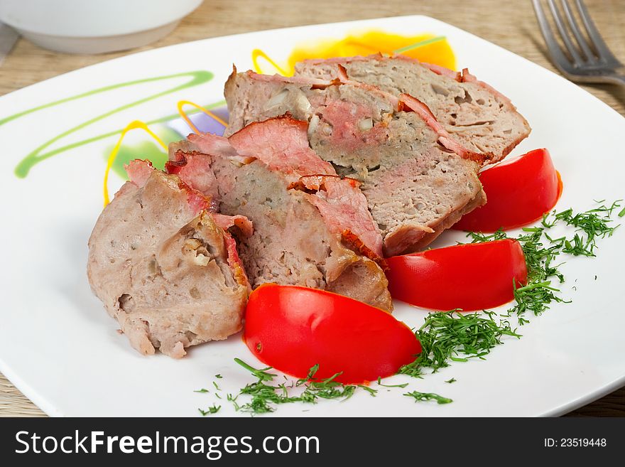 Tasty meal: fresh pate from meat with bacon, tomatoes on plate