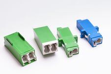 Group Of Fiber Optic Adapters SC And LS Royalty Free Stock Photos