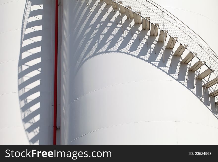 Close up of white storage tank with stairs