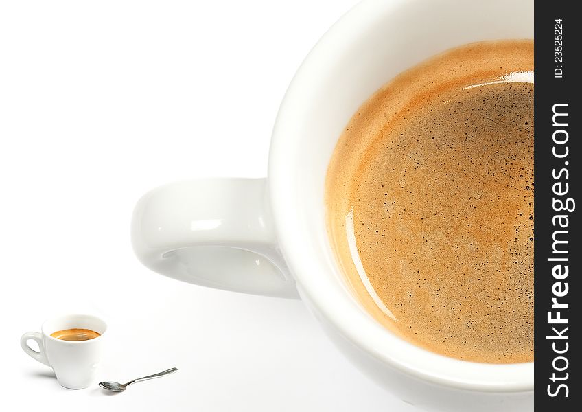 Espresso coffee in a white cup with spoon on white background. Espresso coffee in a white cup with spoon on white background