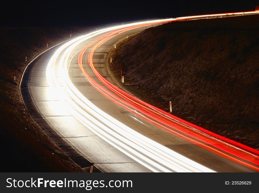 Trails of cars and trucks on the road at night. Trails of cars and trucks on the road at night.