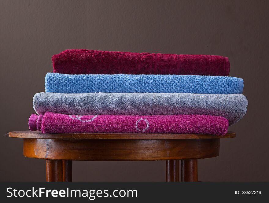 Pile of cotton Colorful towels On a table