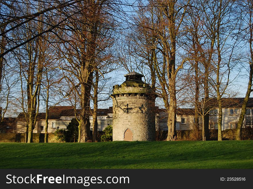 An old round turret among trees in a public park in Dunfermline. An old round turret among trees in a public park in Dunfermline