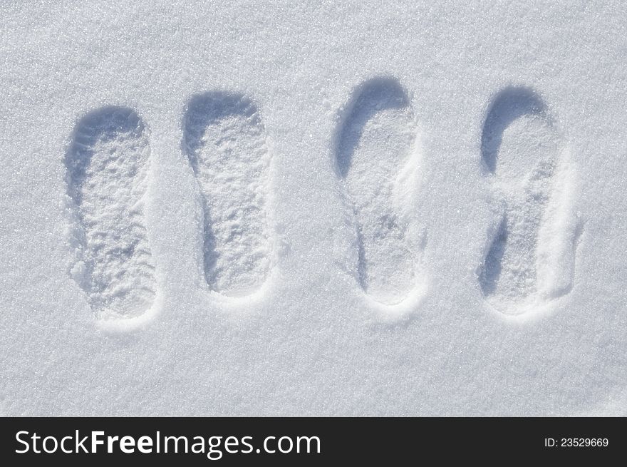 Tracks of man and woman on to snow. Tracks of man and woman on to snow