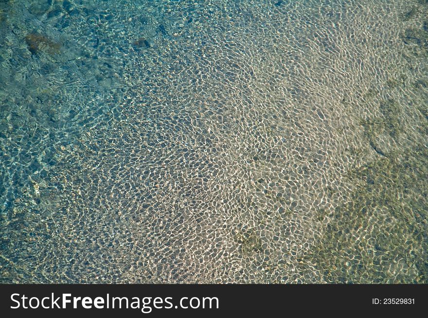 Abstract shallow water pond texture with waves. Abstract shallow water pond texture with waves