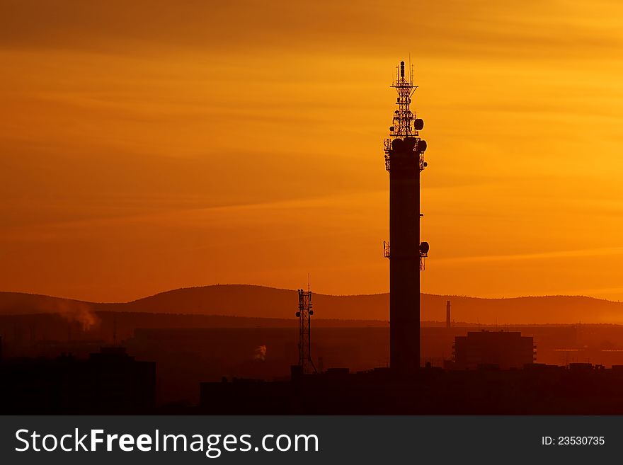Industrial city landscape at sunset