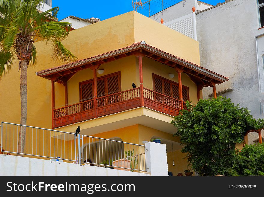 Orange Building With The Balcony, Crows