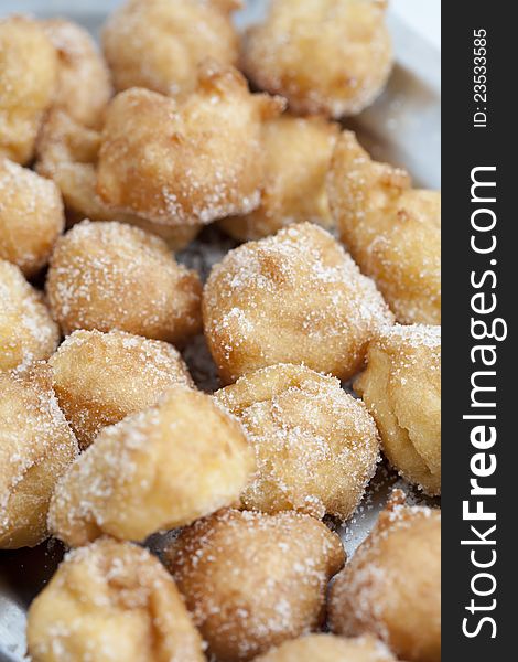 Closeup of delicious fritters with sugar lent. Closeup of delicious fritters with sugar lent