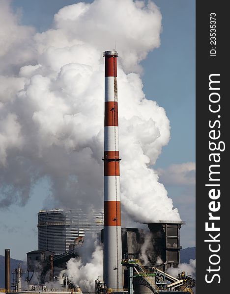 Industrial plant with smoke, air pollution