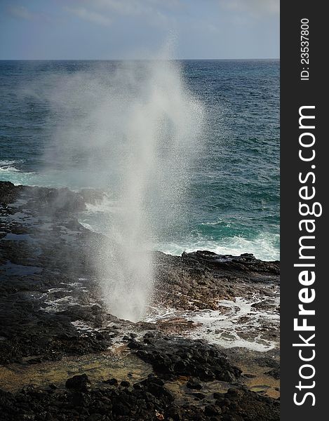 Sea geyser at the Spouting Horn at Poipu Beach, Kauai, Hawaii, USA