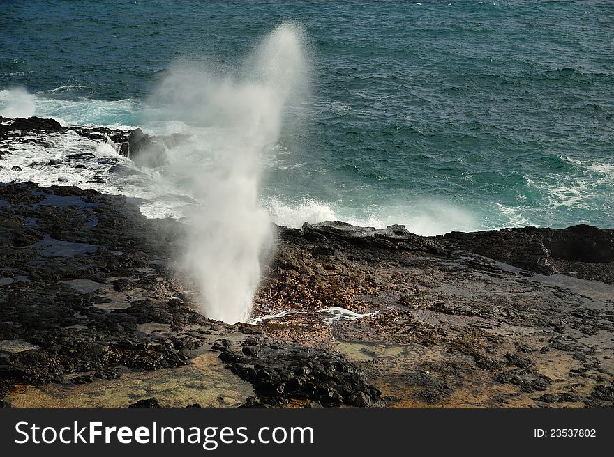 Sea geyser at the Spouting Horn at Poipu Beach, Kauai, Hawaii, USA