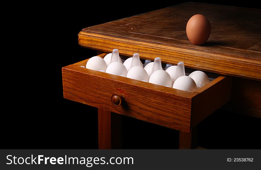 Eggs on old table. isolated on black