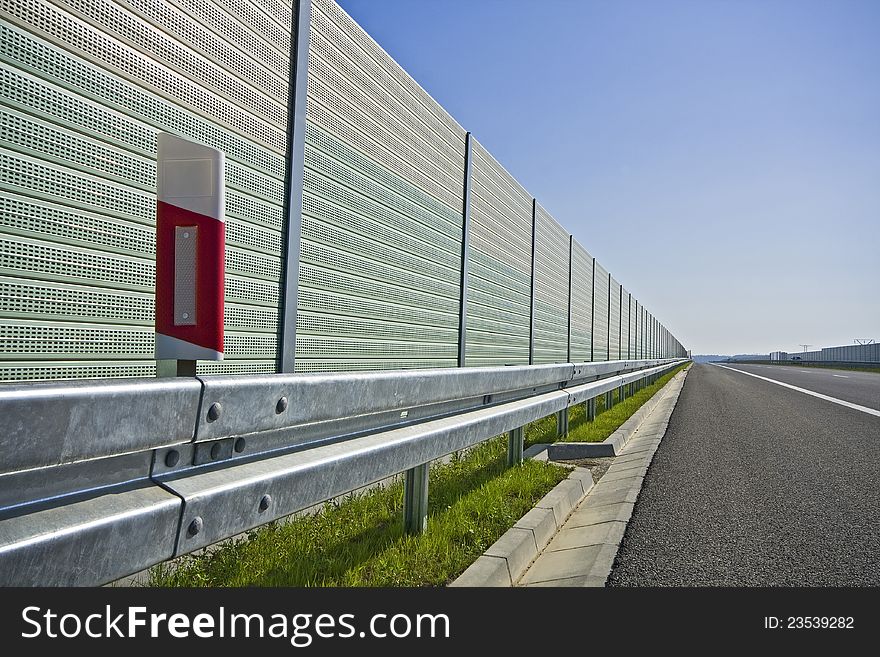 Sound absorption walls on a highway. Sound absorption walls on a highway