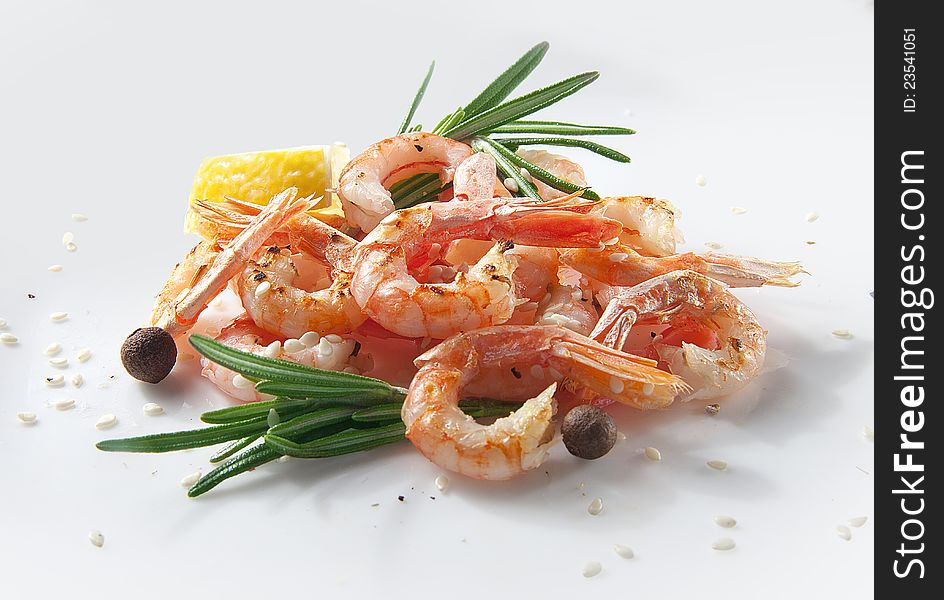 Handful of fried shrimps with rosemary and lemon