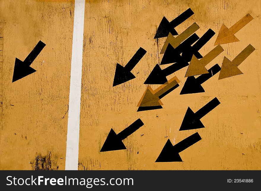 Photo of the illustration: 2 groups of arrows - one isolated and group of black and yellow arrows, metaphoric meaning. Photo of the illustration: 2 groups of arrows - one isolated and group of black and yellow arrows, metaphoric meaning