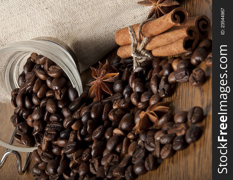 Coffee beans, cinnamon, star anise on a dark background. Coffee beans, cinnamon, star anise on a dark background