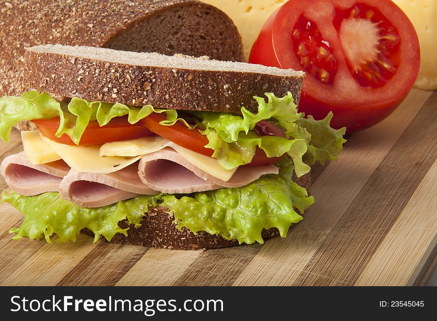 Healthy ham sandwich with cheese, tomatoes and lettuce