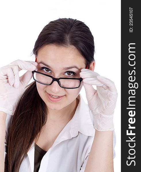 Female doctor looking over his glasses at the camera