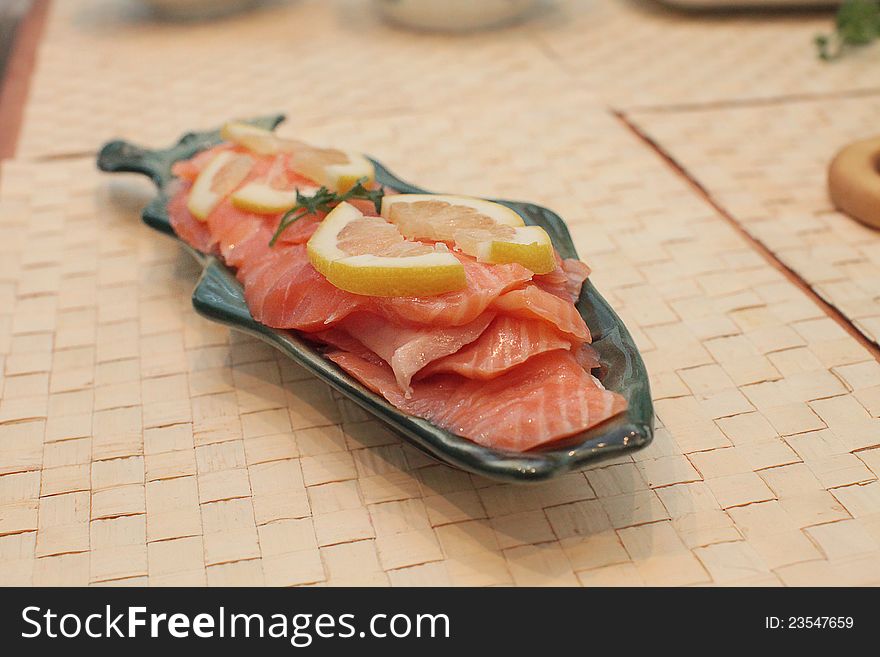 Slices of salty salmon in a dish. Slices of salty salmon in a dish.