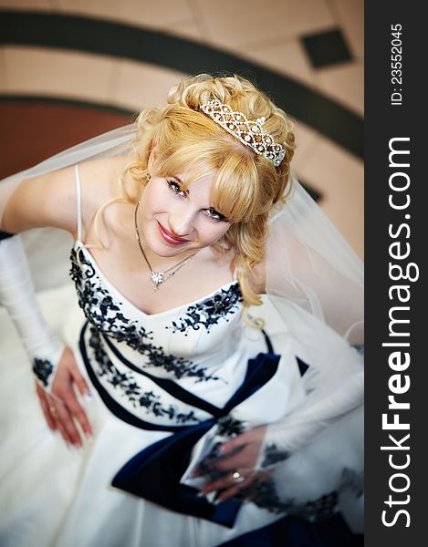 Beautiful bride in wedding dress indoors