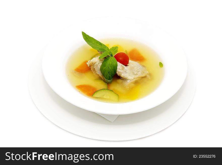 Quail broth with vegetables decorated with mint. Quail broth with vegetables decorated with mint