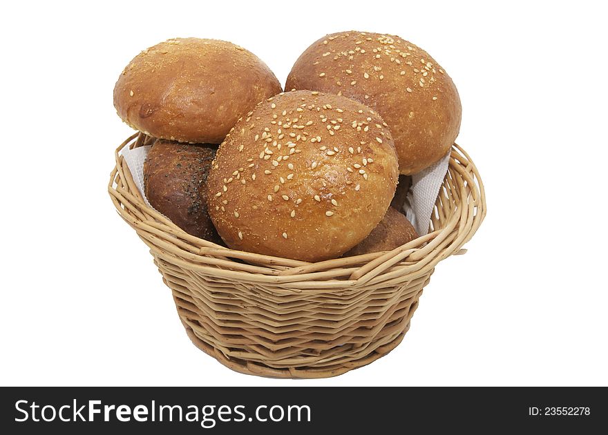 Buns with sesame seeds in a wicker basket