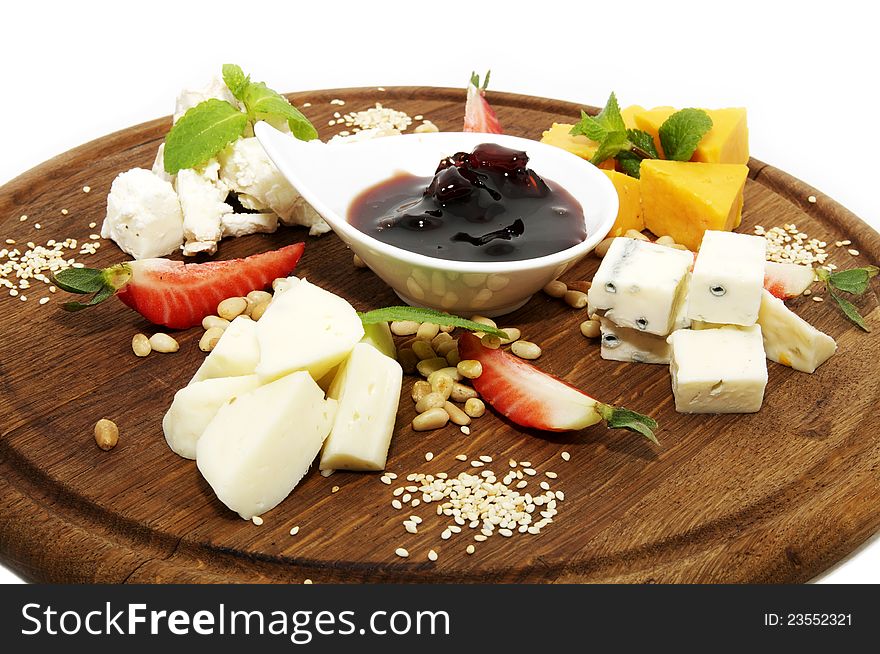Cheese plate with some sauce and cheeses