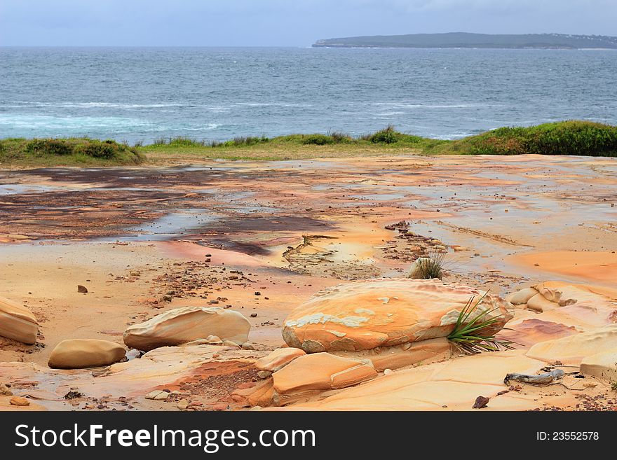 A parched landscape at the ocean &#x28;the Sydney Basin with its characteristic sandstone&#x29;. A parched landscape at the ocean &#x28;the Sydney Basin with its characteristic sandstone&#x29;