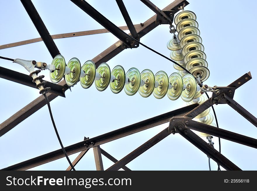 A detail of tension tower on a blue sky background