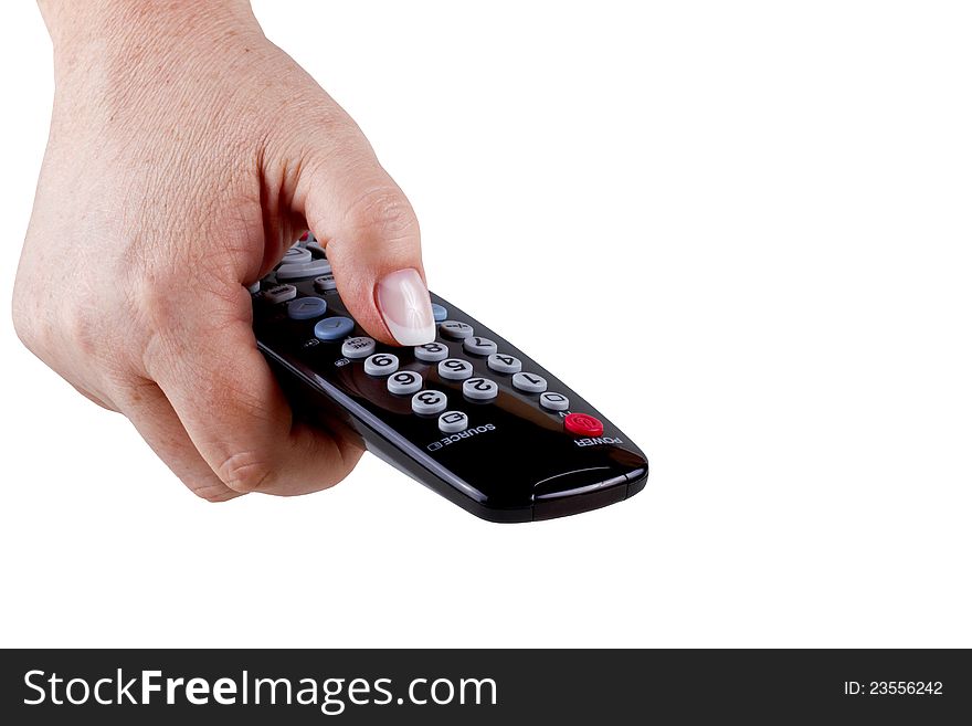 The hand holding a tv remote control