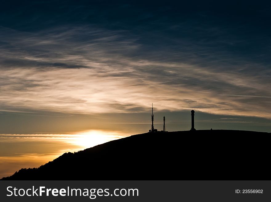 The silhouette of a relay and radar station at sunset taken at the end of summer 2011 in Romania at about 1300m altitude. The silhouette of a relay and radar station at sunset taken at the end of summer 2011 in Romania at about 1300m altitude