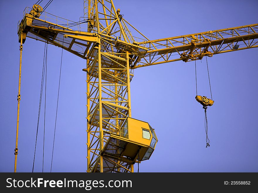 Image of a construction crane on blue sky