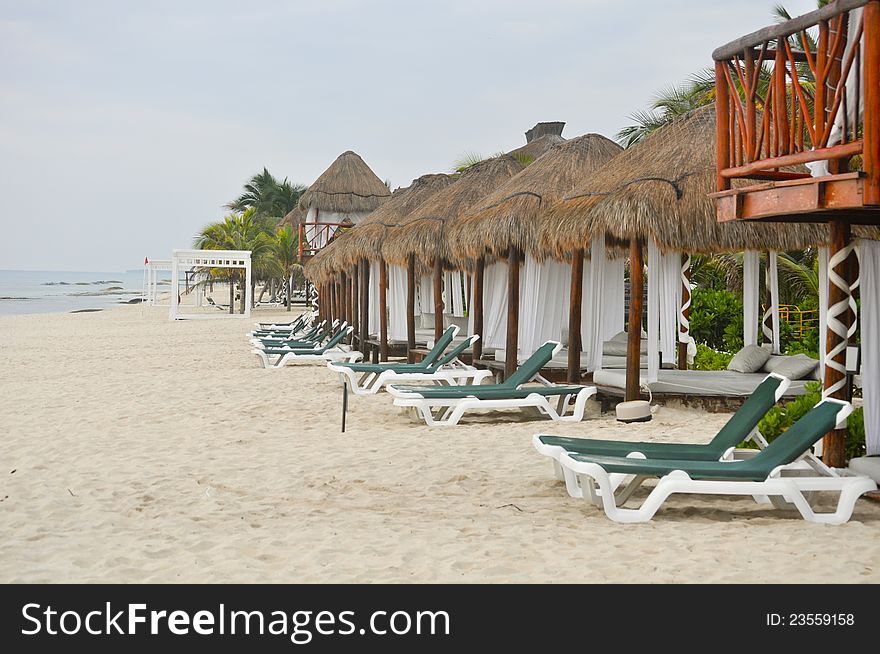 Early morning at the resort with all the beach beds and chairs lined up. Early morning at the resort with all the beach beds and chairs lined up