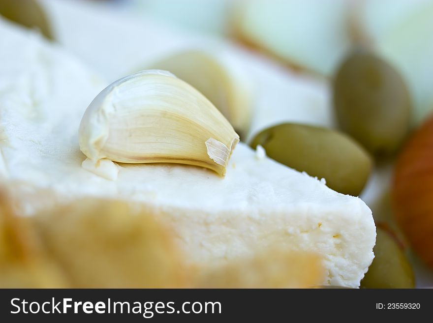Goat's cheese with garlic, olives and bread. Goat's cheese with garlic, olives and bread